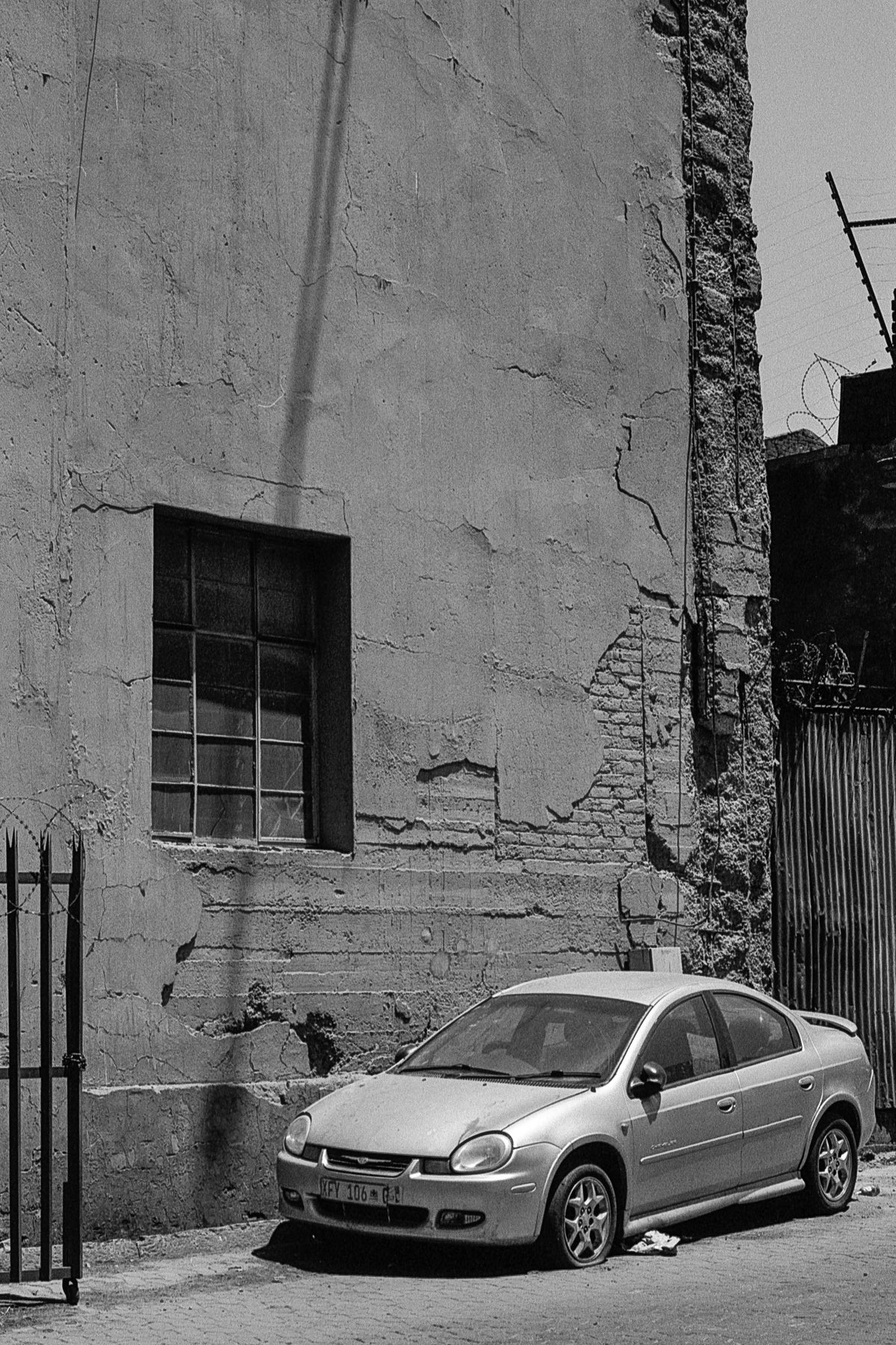 Newtown wall and car