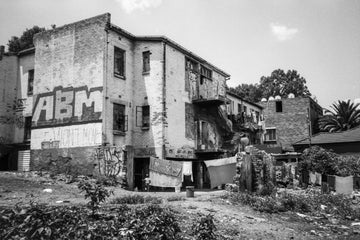 Deteriorating Johannesburg building and child