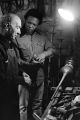 Alf Kumalo-A young Hugh Masekela with trumpet maker...