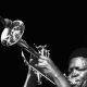 Alf Kumalo-Hugh Masekela blowing a trumpet